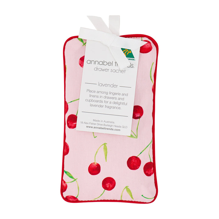 Pink drawer sachet with cherry design and visible brand label on a white background