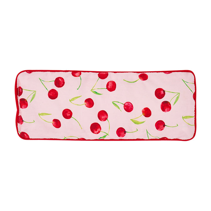 Rectangular pink eye rest pillow with cherry pattern on a white background