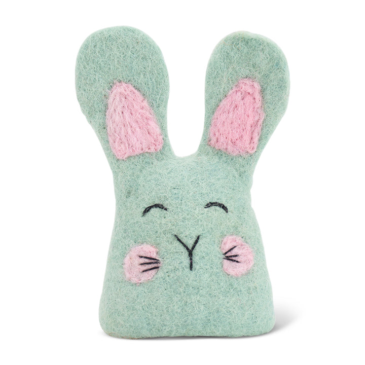 Green felt egg warmer with pink ears and cheeks on a white background