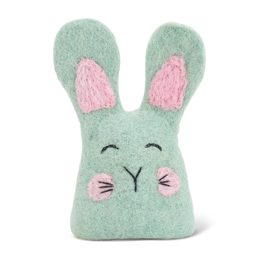 Green felt egg warmer with pink ears and cheeks on a white background