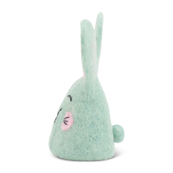 green felt egg warmer with pink ears and cheeks on a white background