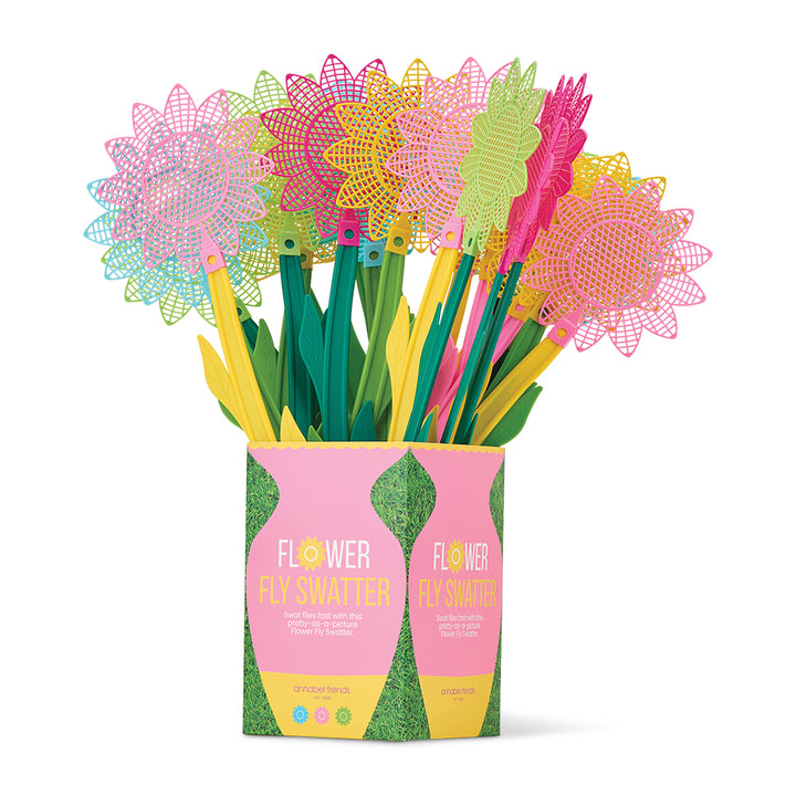 Colorful fly swatters in a decorative box on a white background