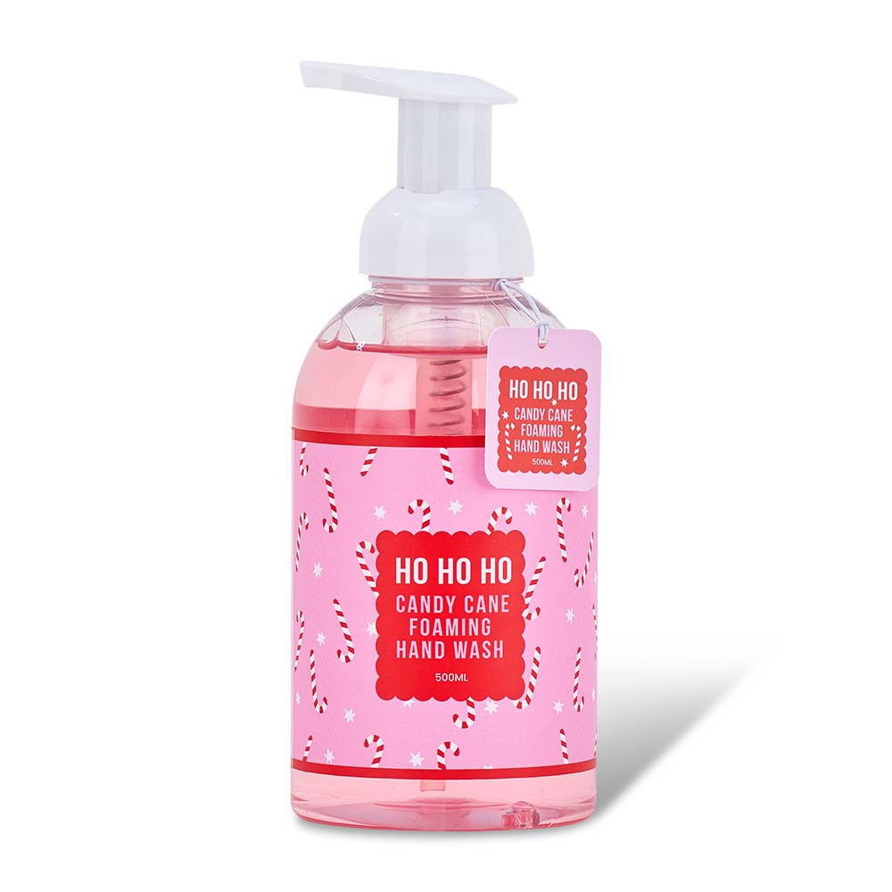 Pink foaming hand wash bottle with candy cane design on a white background
