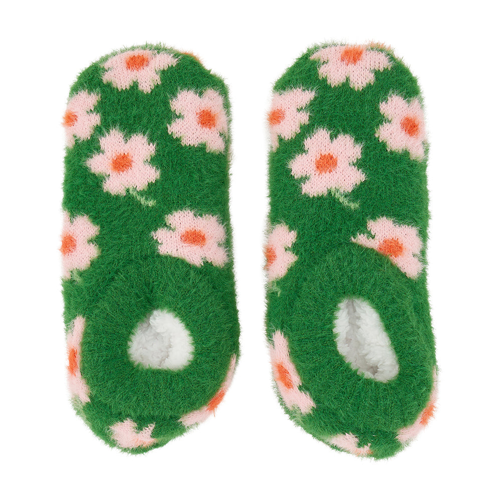 Pair of green fuzzy bootie with floral pattern on a white background