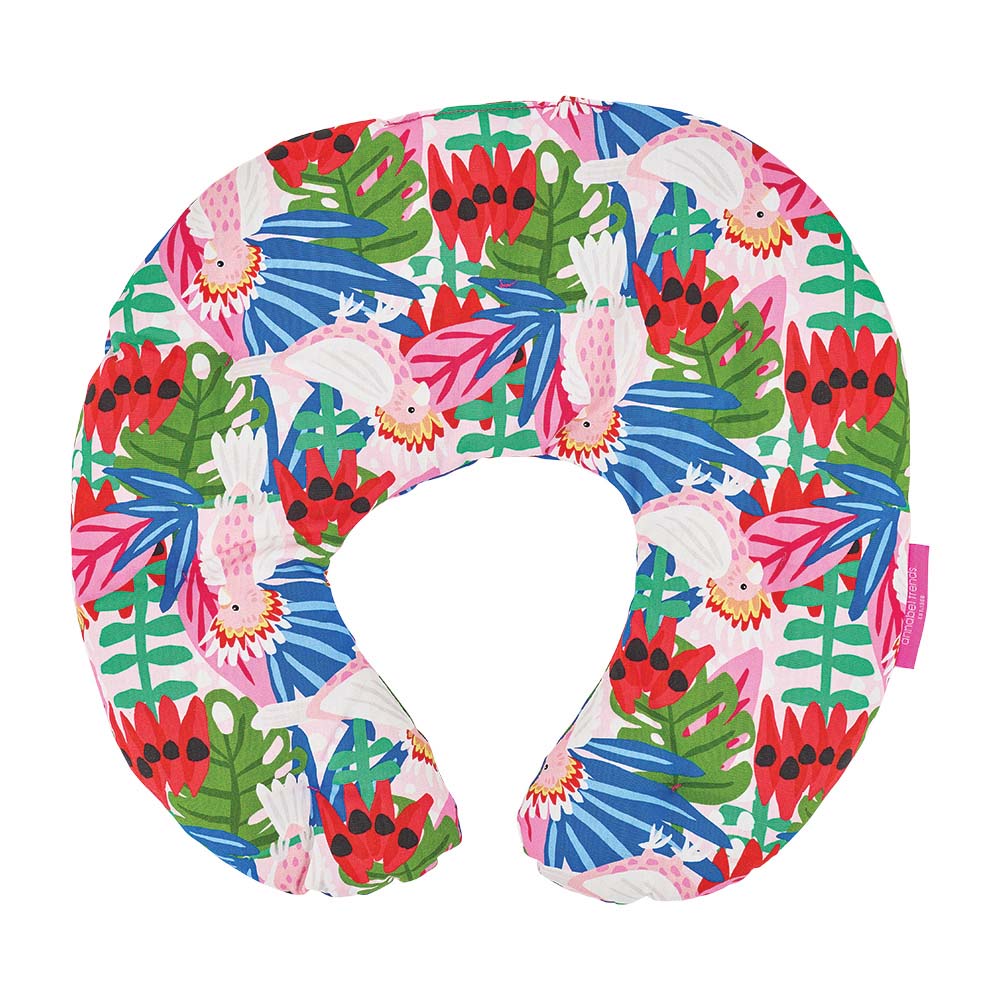 Colorful neck pillow with tropical leaf and flamingo pattern on a white background