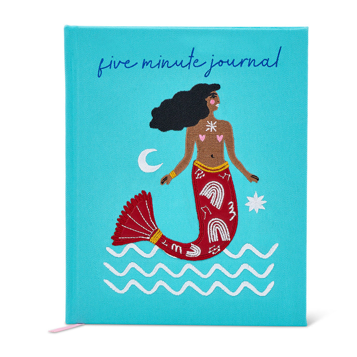 Journal with mermaid illustration on a blue background