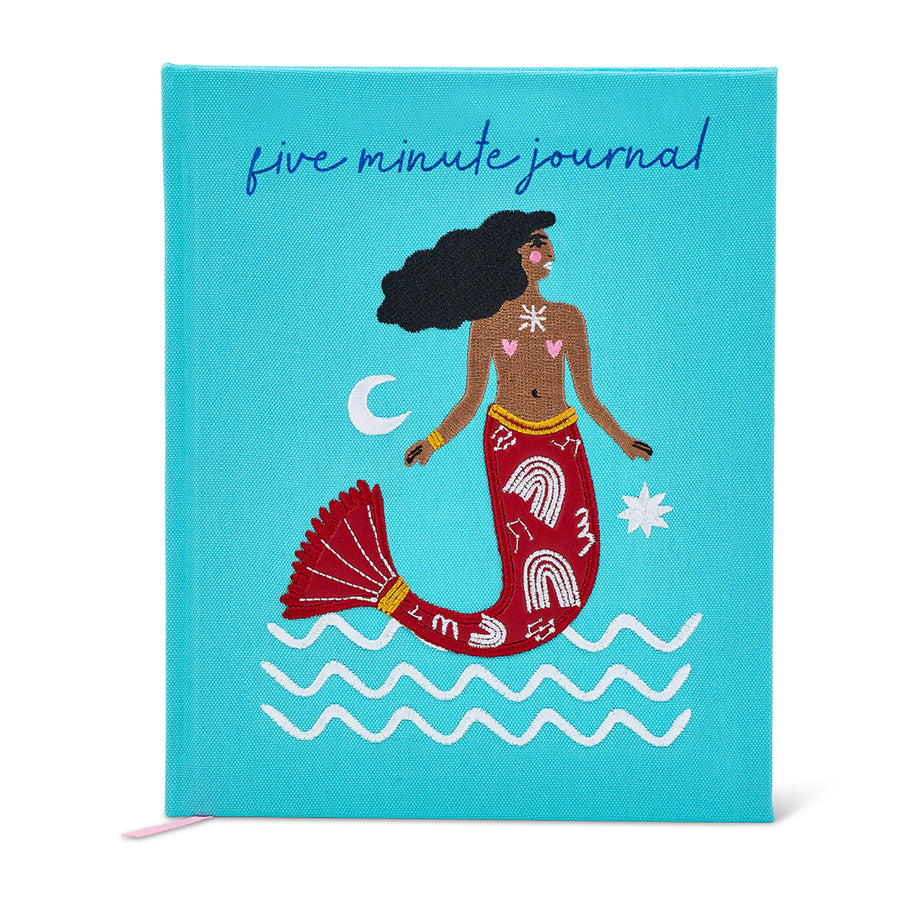 Journal with mermaid illustration on a blue background