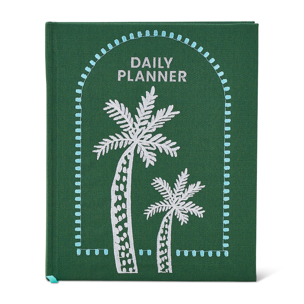 Green daily planner with white palm tree designs on a white background