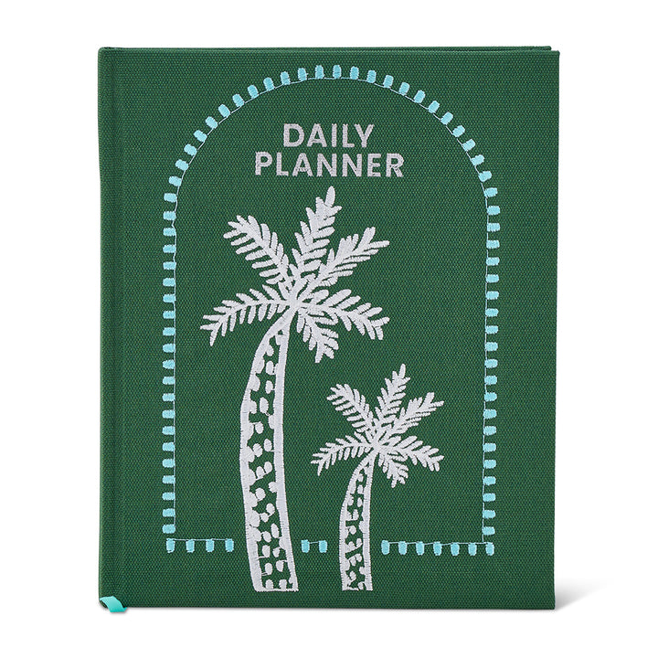 Green daily planner with white palm tree designs on a white background