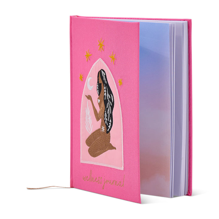 Pink journal with a woman illustration on a white background