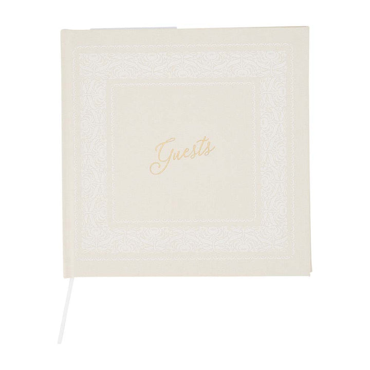 cream guest book with 'Guests' text on a white background