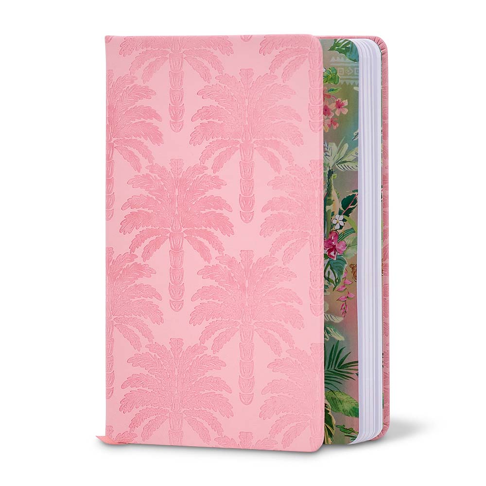Pink notebook with palm leaf pattern on one side and floral design on the other, on a white background.