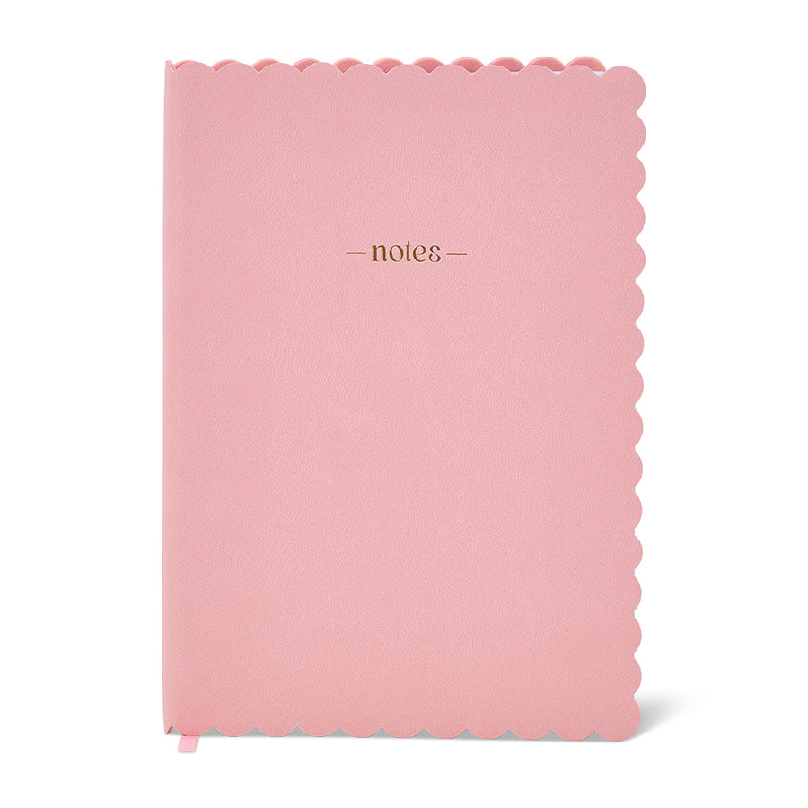 Pink notebook with scalloped edge and 'notes' text on a white background