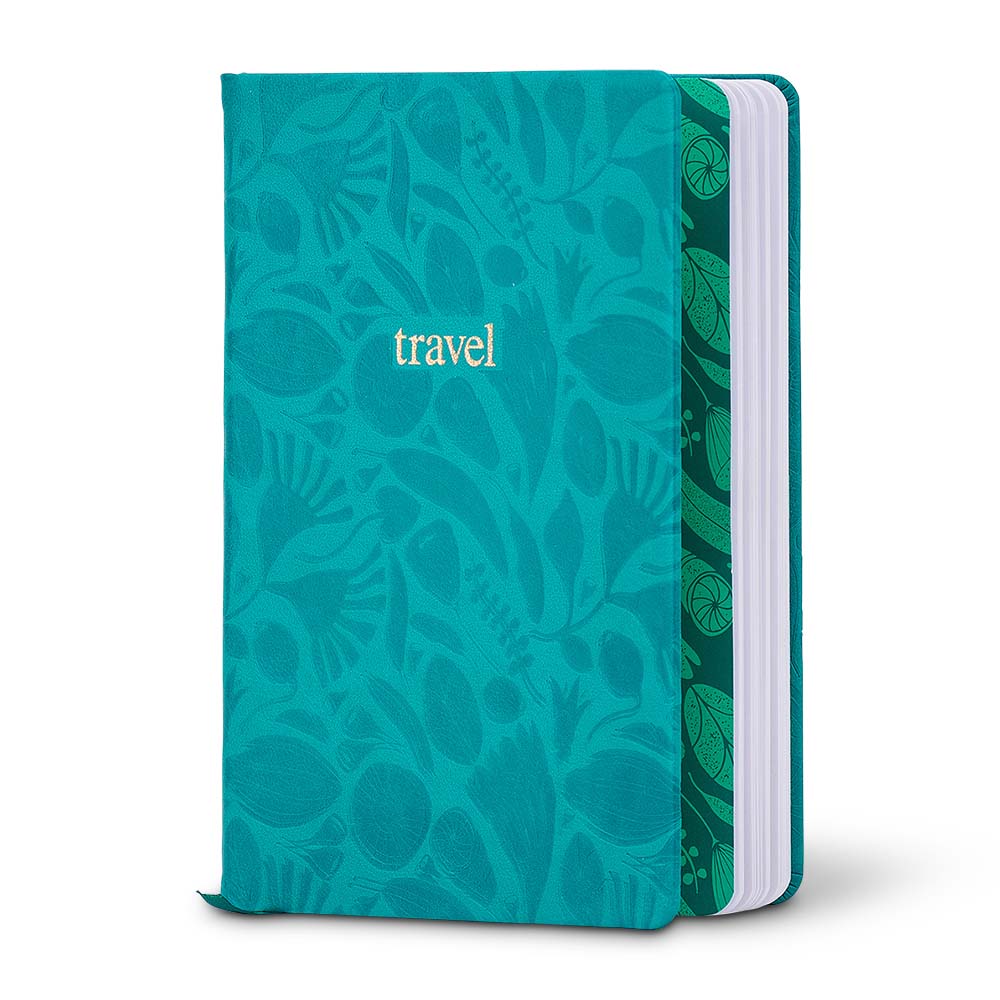 Teal notebook with floral pattern and 'travel' text on a white background