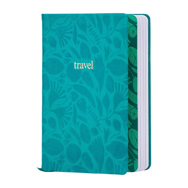 Teal travel notebook with floral pattern on a white background