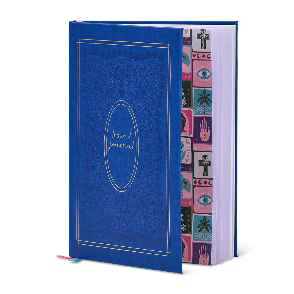 Blue travel journal with a patterned interior on a white background