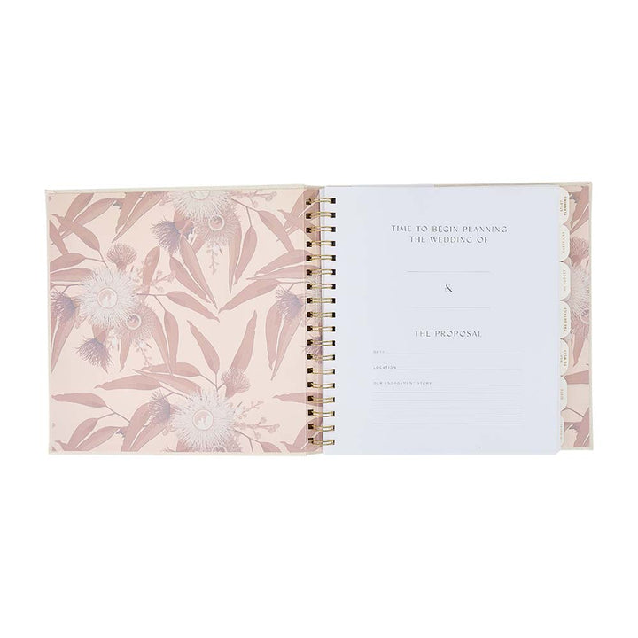 Spiral-bound planner with floral design on cover and text on inside page