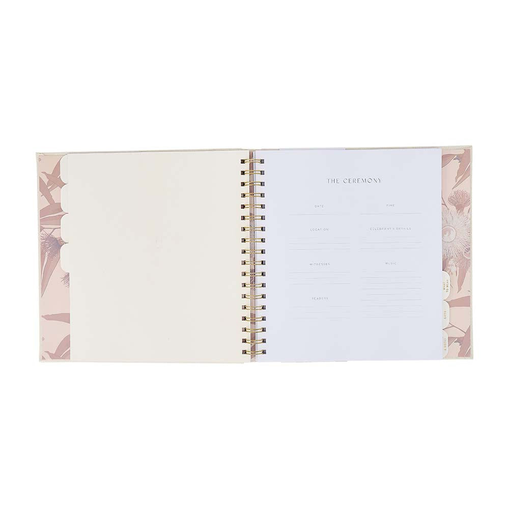 Open planner with floral design on a white background