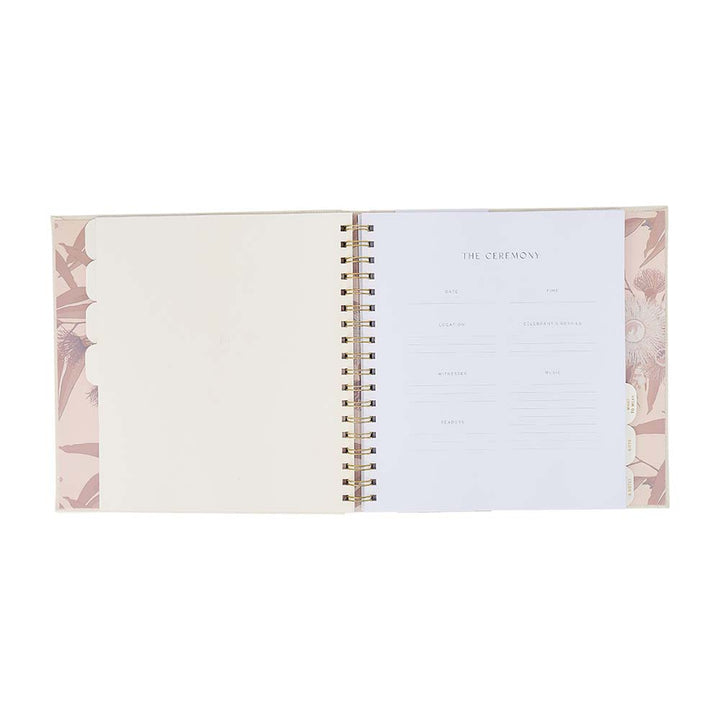 Open planner with floral design on a white background