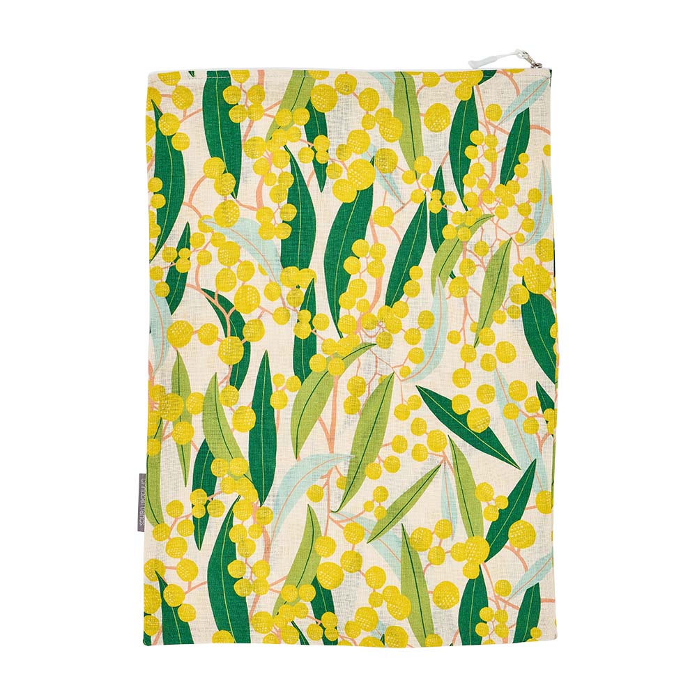 Laundry bag with a floral design featuring yellow flowers and green leaves on a white background