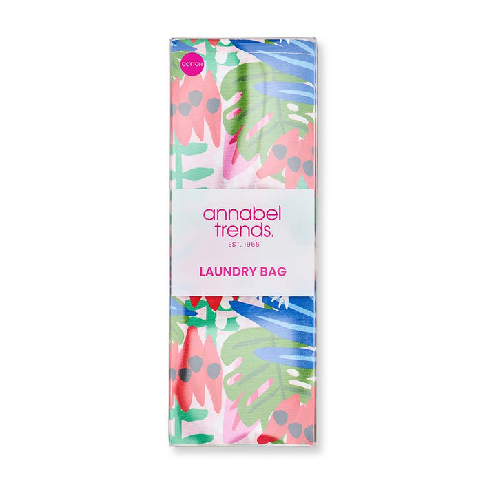Packaging of an annabel trends laundry bag with colorful leaf design on a white background