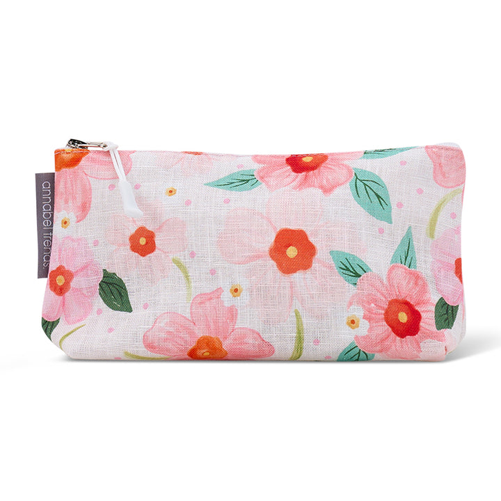 Floral-patterned cosmetic bag with a visible brand label on a white background