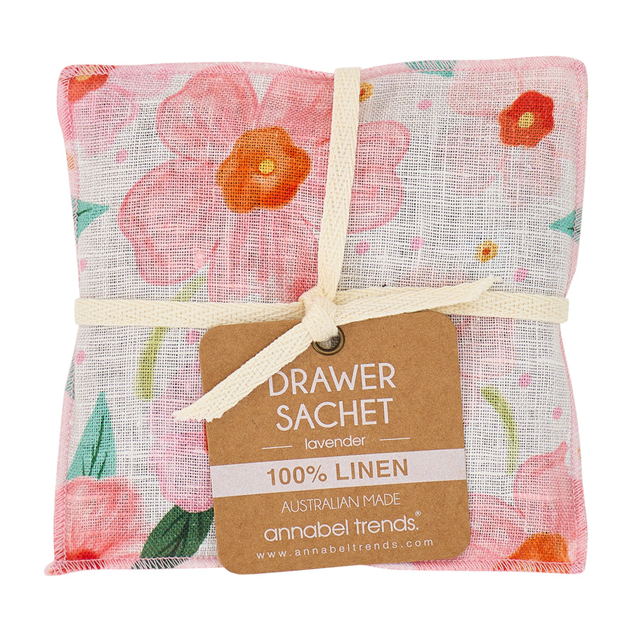 Floral linen drawer sachet with a label on a white background