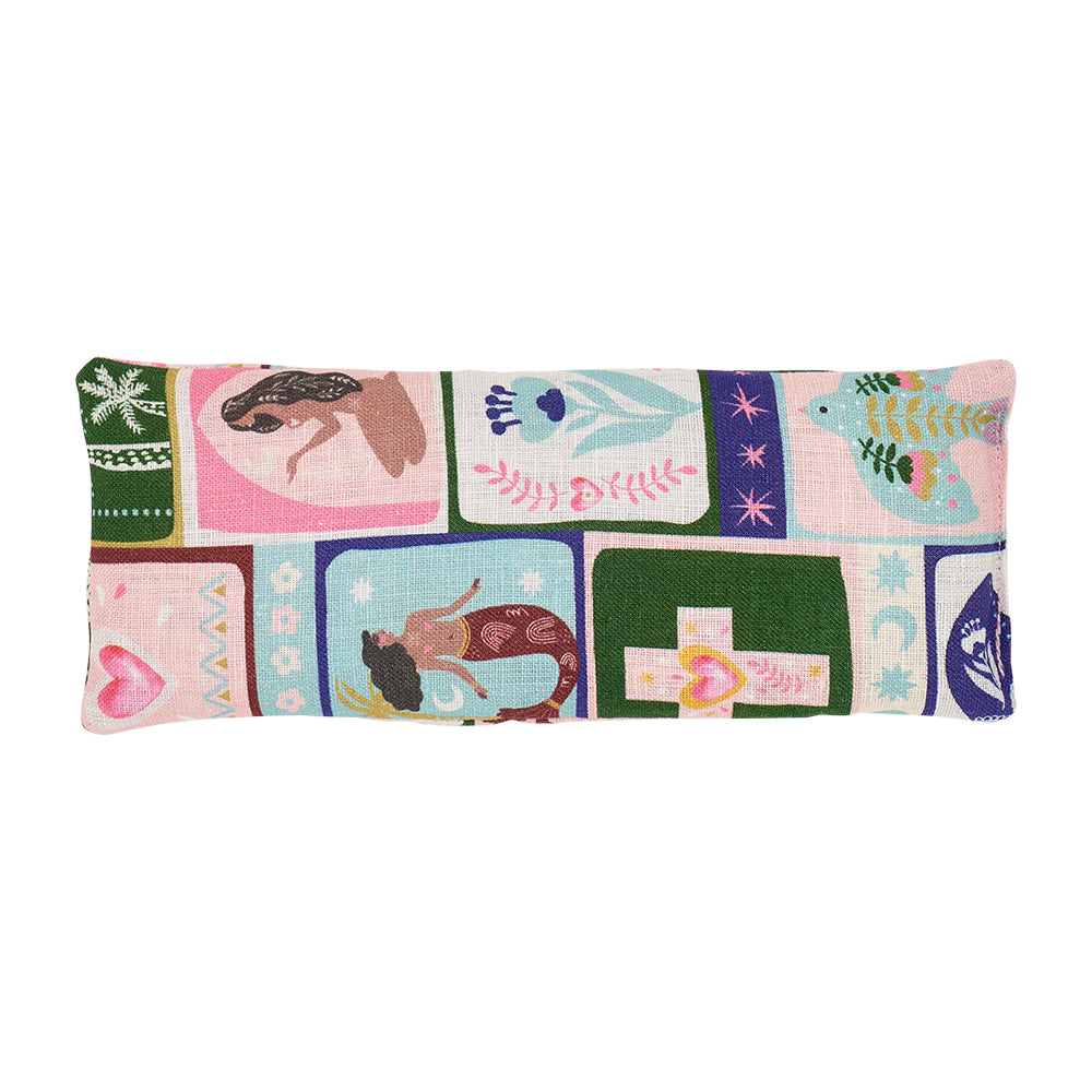 Rectangular eye rest pillow with colourful celestial dreams patchwork design on a white background