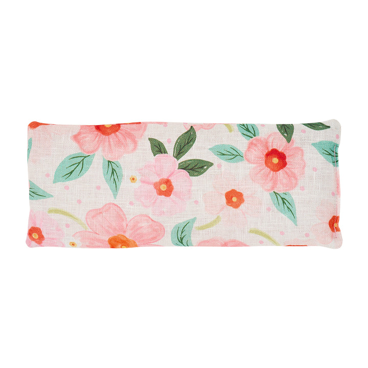 Floral patterned Meadow blush eye pillow on a white background
