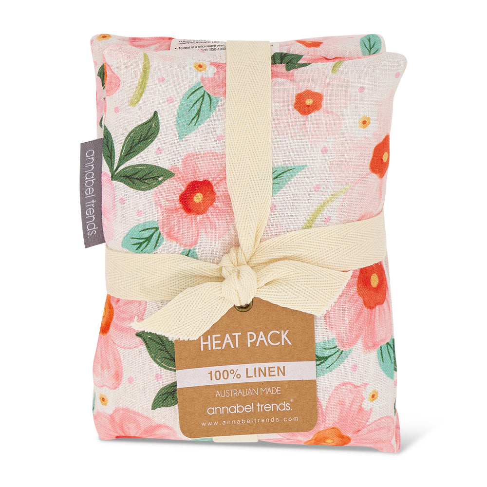 Floral-patterned heat pack with a bow and 'annabel trends' label on a white background