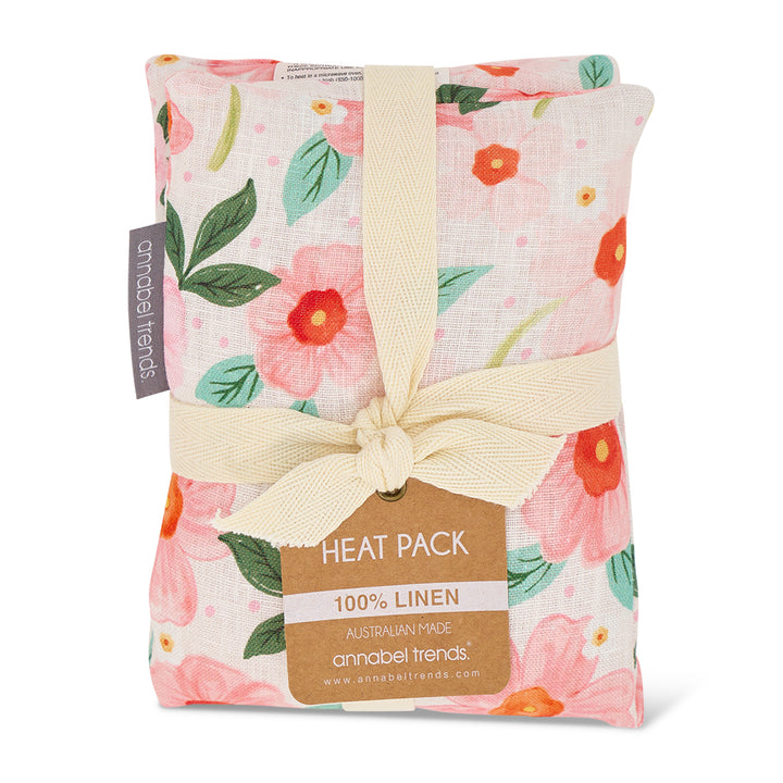 Floral-patterned heat pack with a bow and 'annabel trends' label on a white background