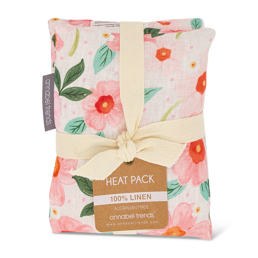 Floral-patterned heat pack with a bow and 'annabel trends' label on a white background