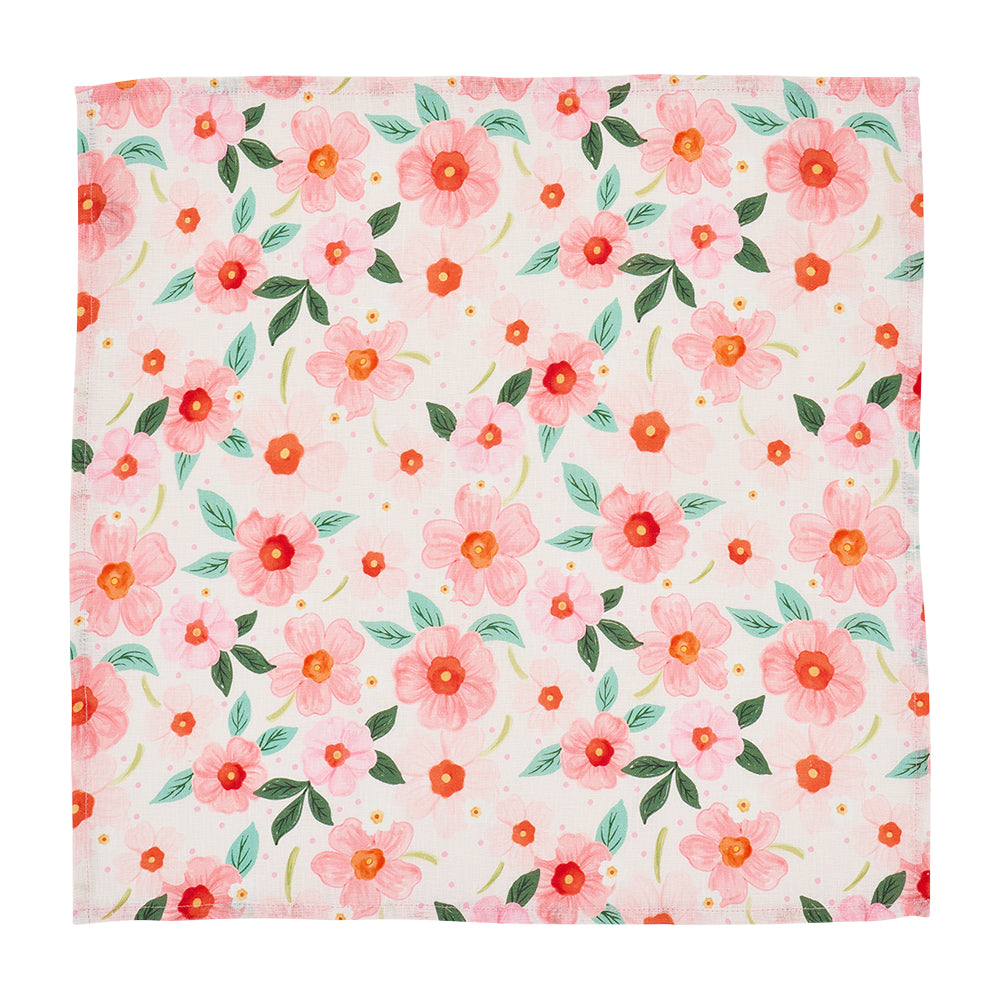 Floral pattern napkin with pink flowers and green leaves on a white background