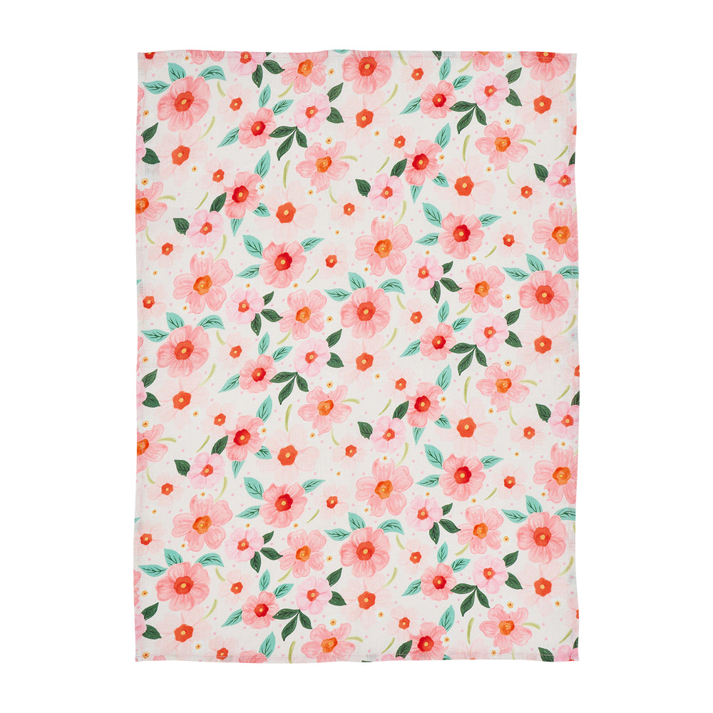 Floral patterned linen tea towel with pink and orange flowers on a white  background