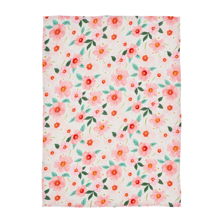 Floral patterned linen tea towel with pink and orange flowers on a white  background