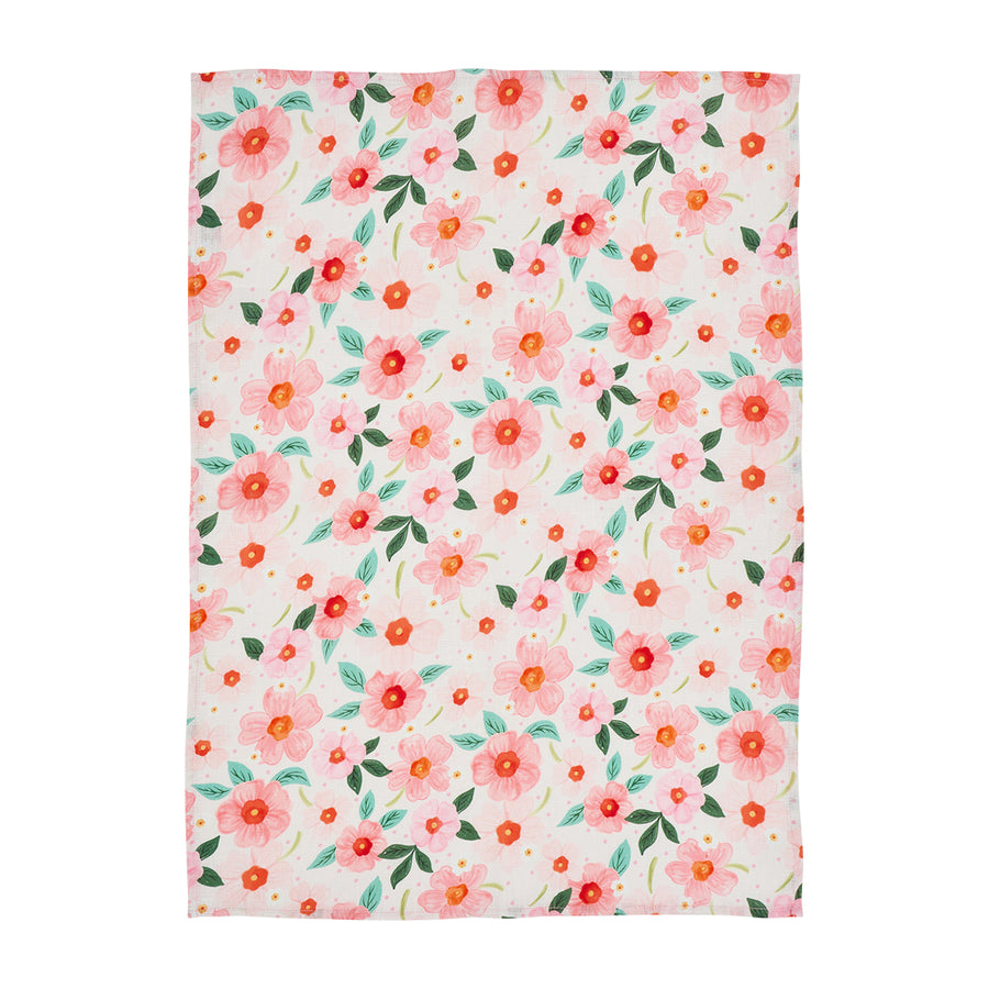 Floral patterned linen tea towel with pink and orange flowers on a white  background