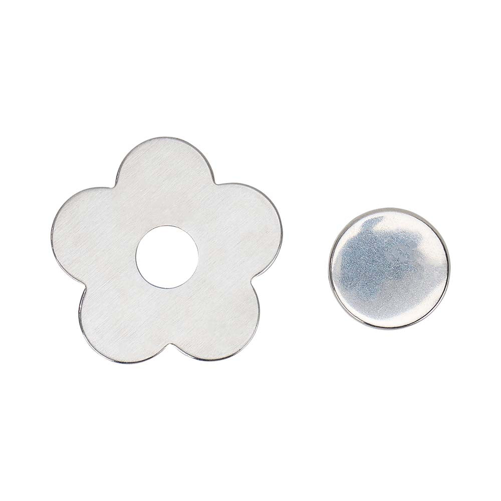 Flower-shaped metal washer and round metal washer on a white background