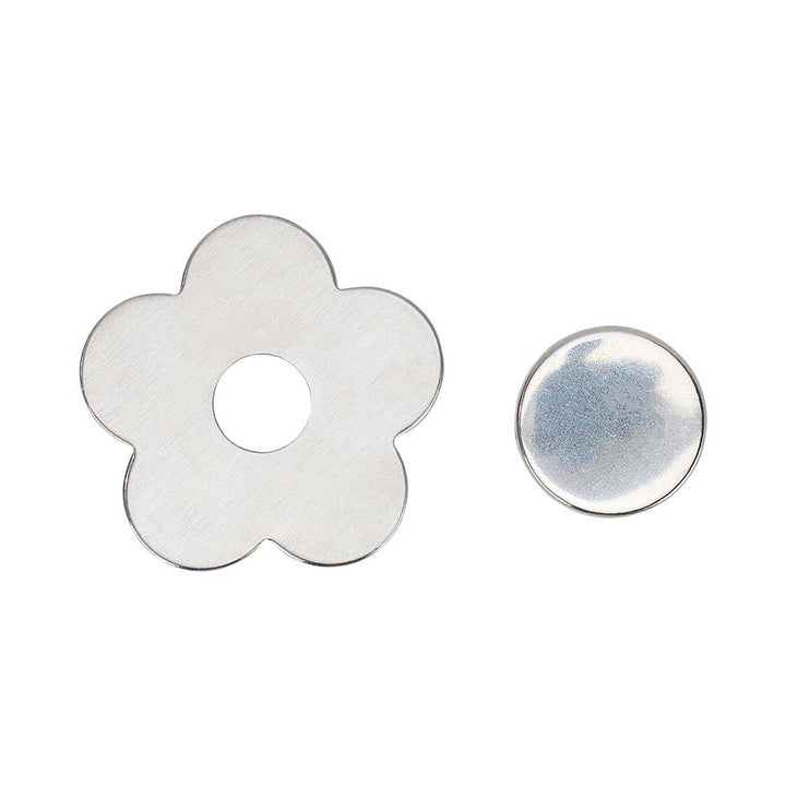 Flower-shaped metal washer and round metal washer on a white background