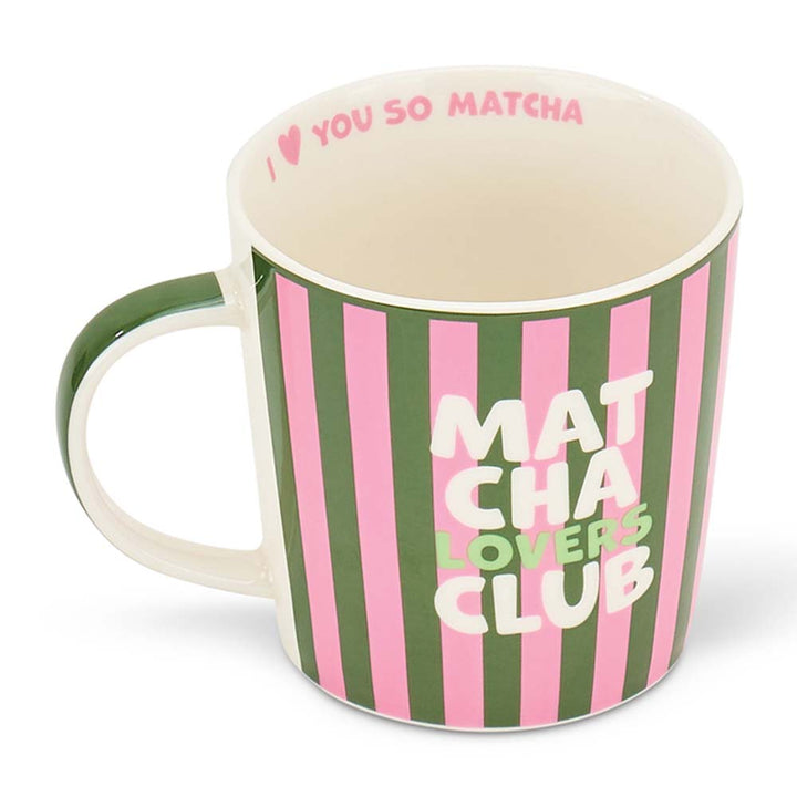 Mug with green and pink striped design and text on a white background