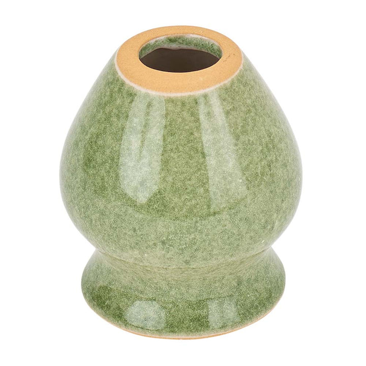 Green ceramic vase with a textured surface on a white background