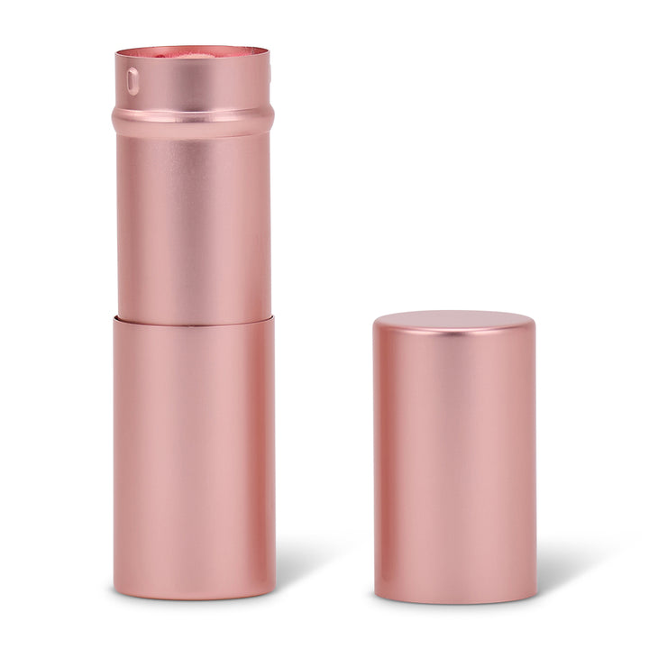 Rose gold metal canister for kabuki brush on a white background