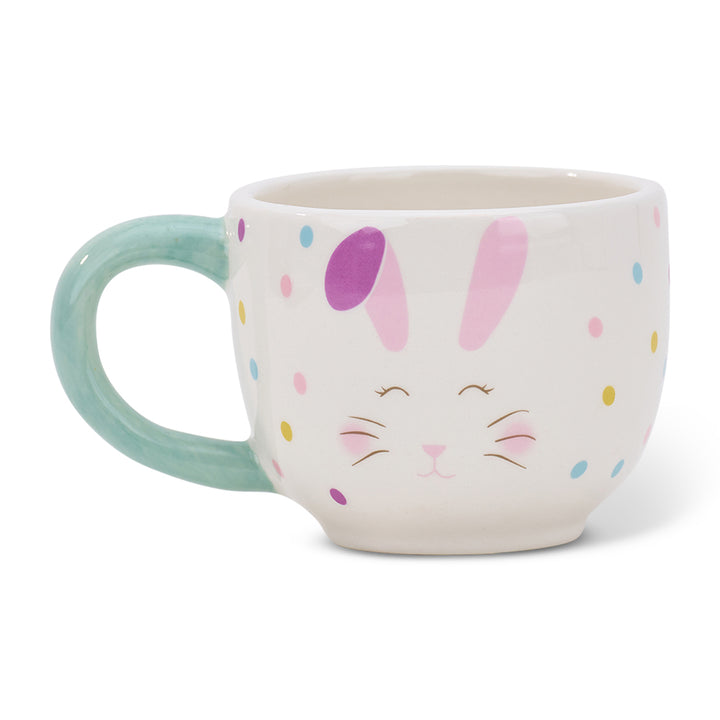 Ceramic mug with bunny design on a white background