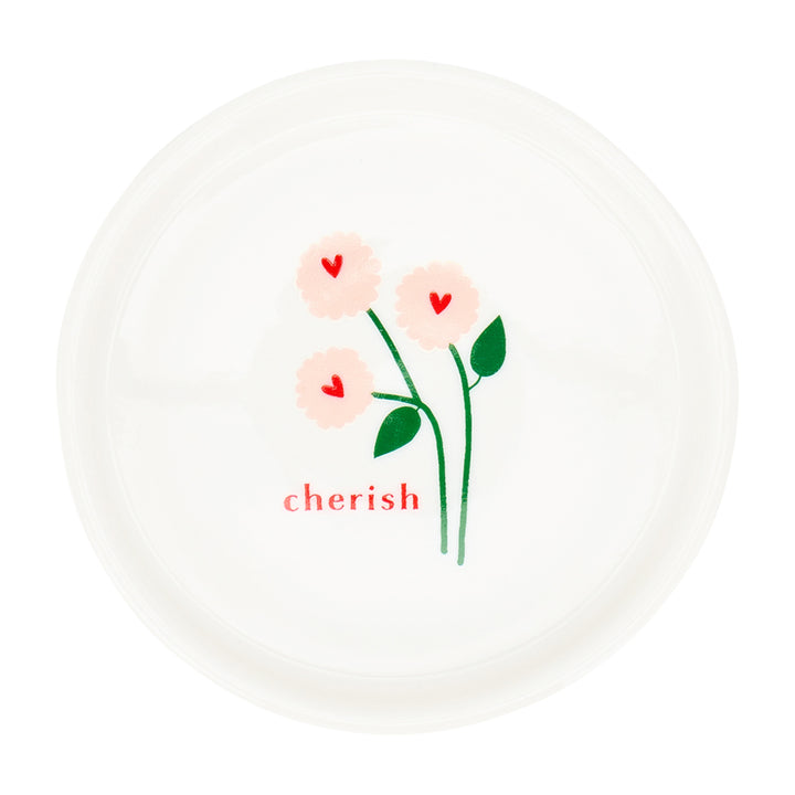 Decorative plate with floral design and 'cherish' text on a white background