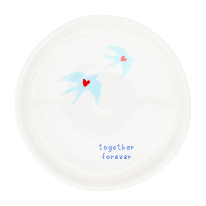 White plate with blue birds and red hearts, featuring the text 'together forever' on a white background.