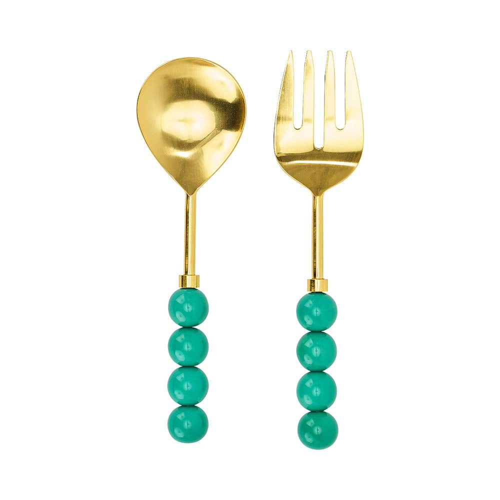 Gold spoon and fork with turquoise bead handles on a white background