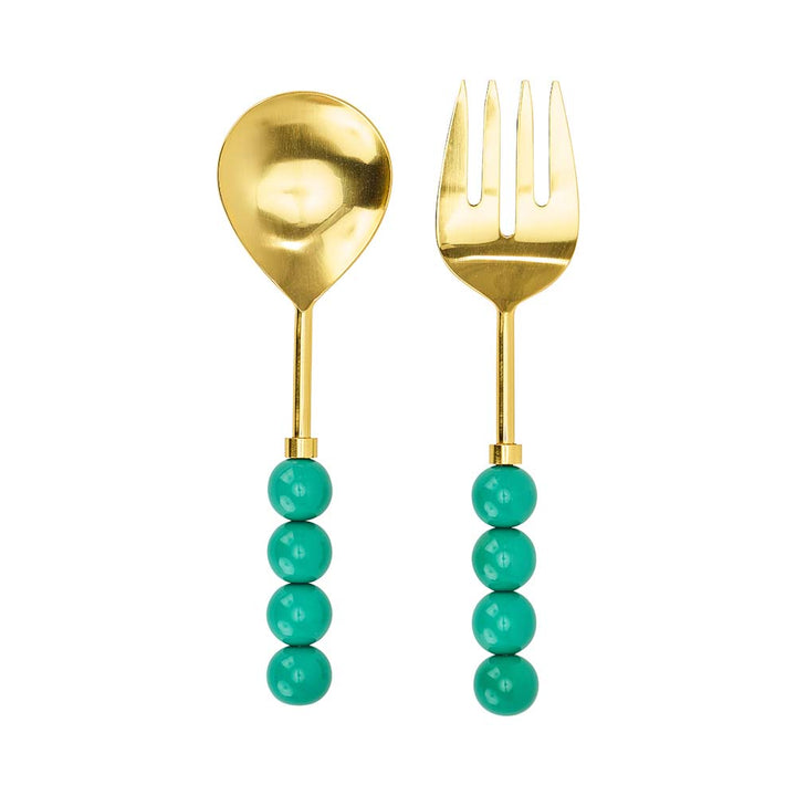 Gold spoon and fork with turquoise bead handles on a white background