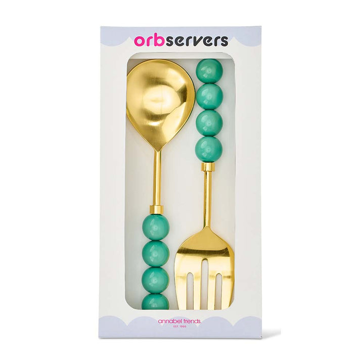 Gold spoon and fork set with turquoise beads in packaging, brand 'orbservers' visible