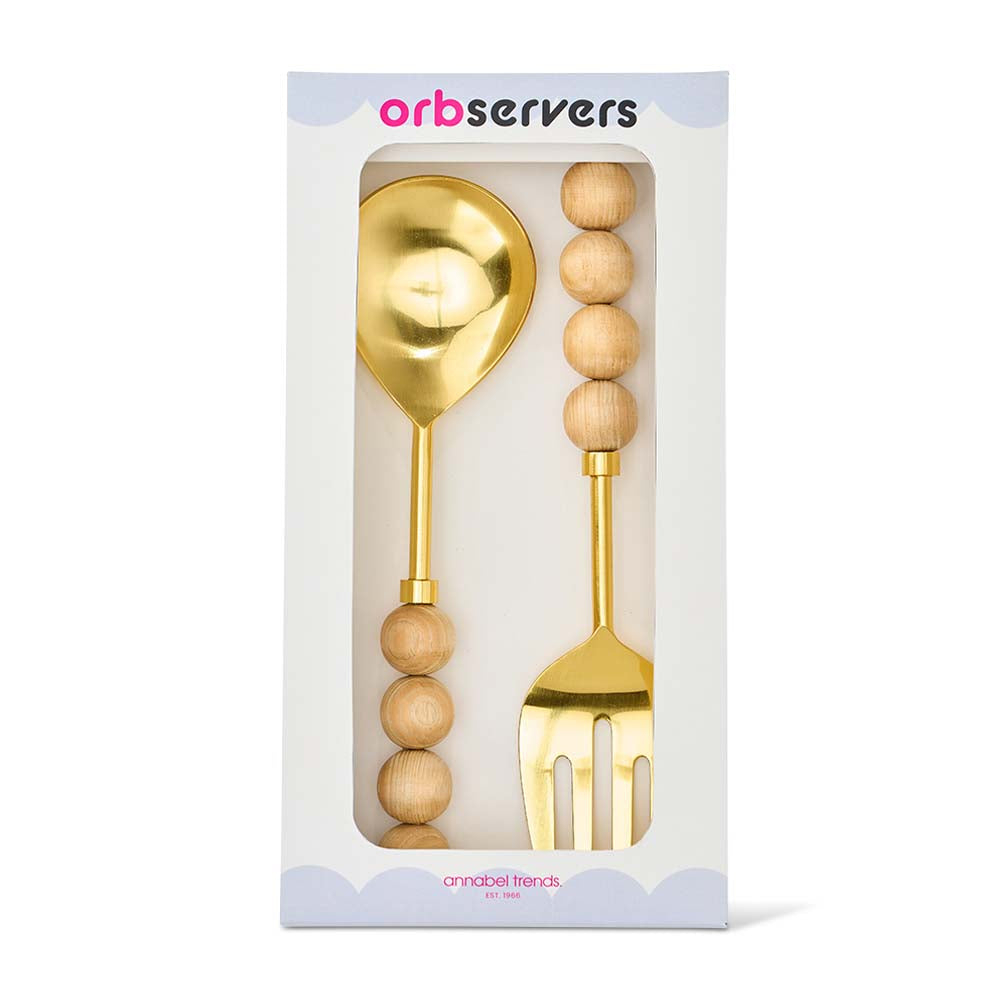 Gold spoon and fork set with wooden handles in packaging, brand 'orb servers' visible.