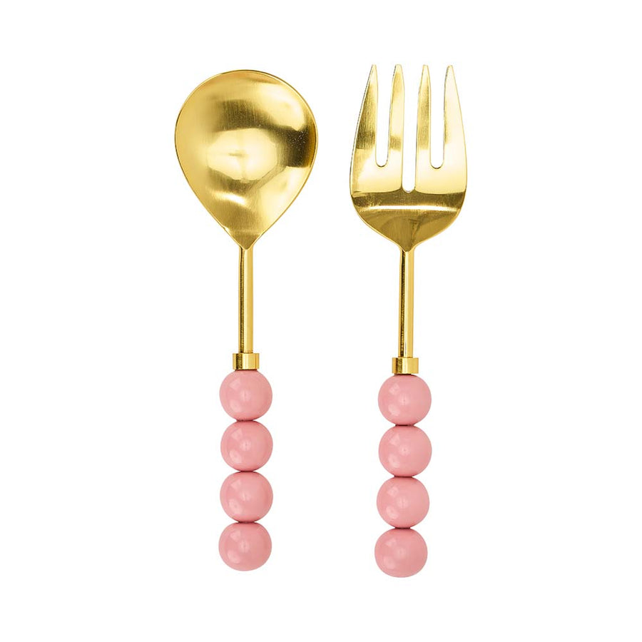 Gold spoon and fork with pink bead handles on a white background