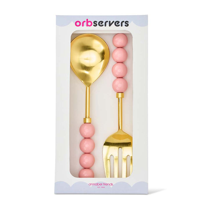 Gold spoon and fork set with pink beads in packaging, brand 'orbservers' visible